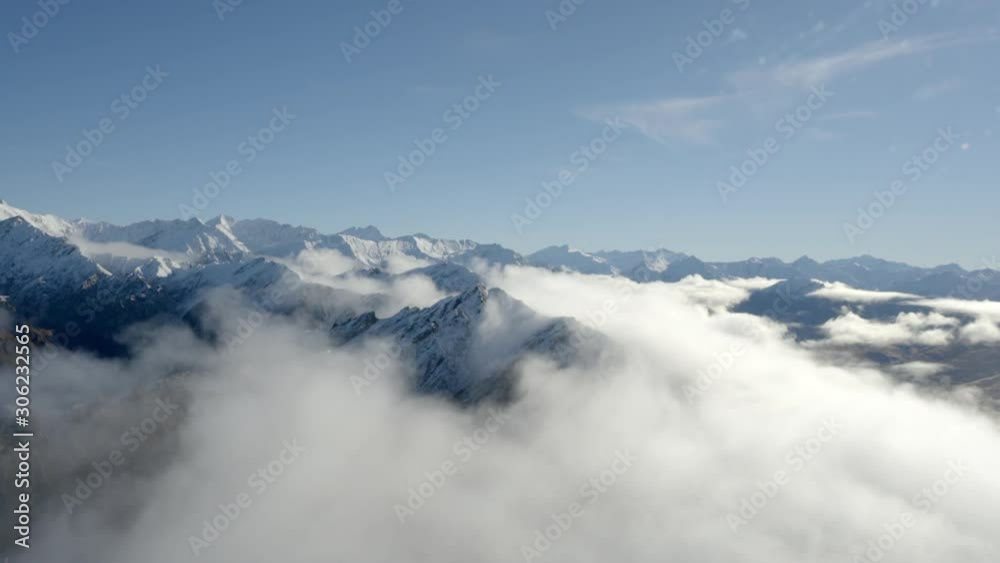 Beautiful Mountain peaks above clouds Beautiful Mountain peaks above clouds
