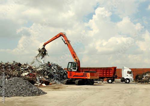 photo of a large truck loading crane on a truck