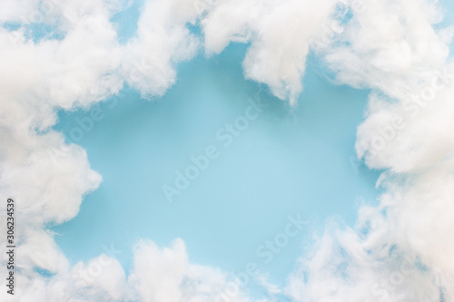 Soft clean cotton on light blue background.Frame clouds and copy space