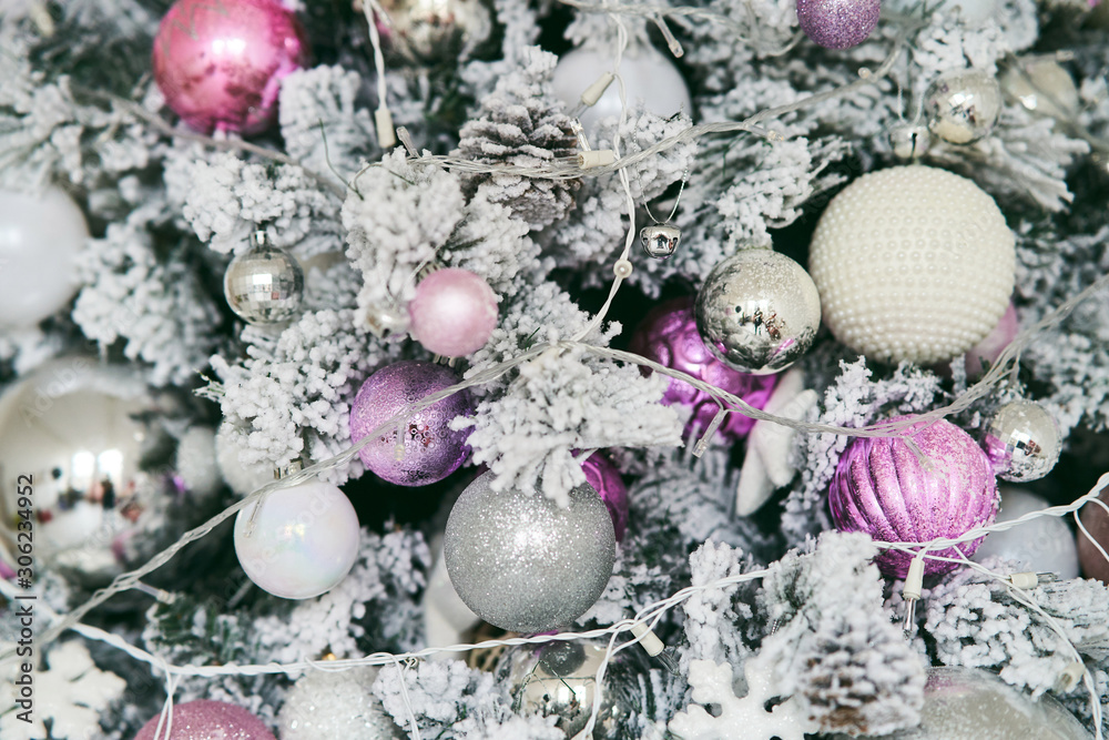 Christmas tree with New Year s balls and a garland. Christmas tree with New Year s balls and a garland.