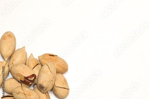 Many Pecan nuts isolated on white background