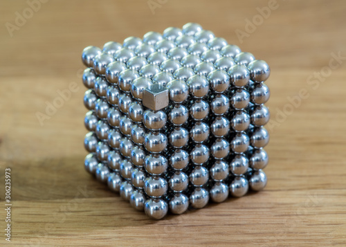 metal ball in a cube of square magnets