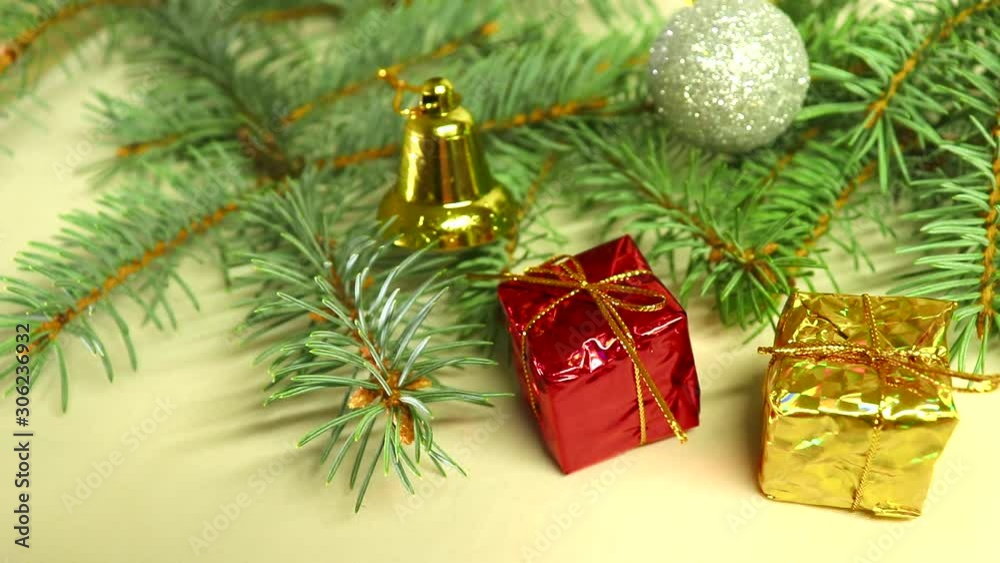 Merry christmas and a happy new year! Christmas-tree decorations “float” in front of the camera lens. Merry christmas and a happy new year! Christmas-tree decorations “float” in front of the camera lens.