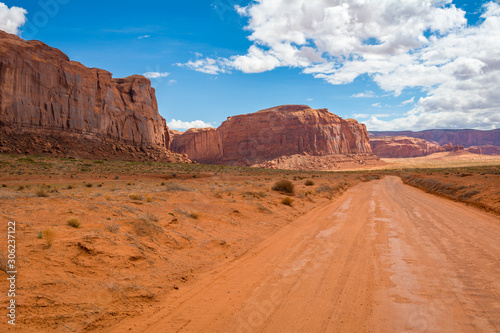 Road and red rocks in Monument Valley. Navajo Tribal Park landscape, Utah/Arizona, USA