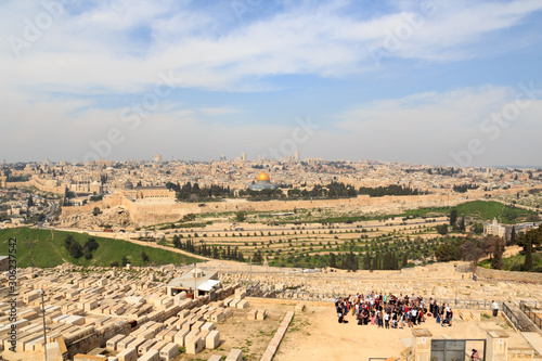 Mount of Olives Jewish Cemetery and Jerusalem Old city cityscape panorama with Dome of the Rock with gold leaf and Al-Aqsa Mosque on Temple Mount and Rotunda of Church of the Holy Sepulchre, Israel