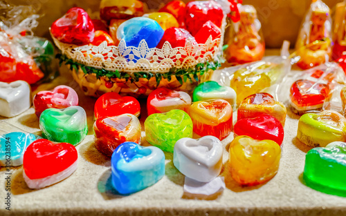 Handmade Soap Souvenirs at stalls during Christmas market in Riga, Latvia. Wooden balls in jar as decoration in home. Street Xmas holiday fair. Advent and Stalls with Crafts Items on Bazaar