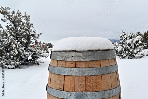 wooden barrel in the snow