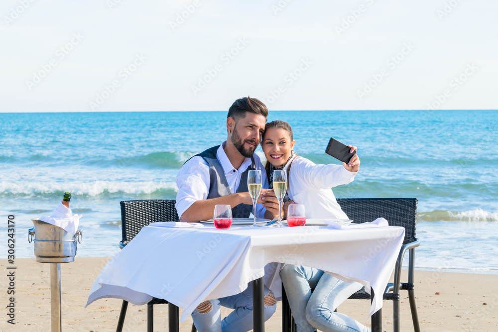 Couple they make a selfie on the beach