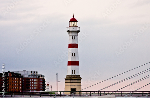 Classic lighthouse at a harbour entrance