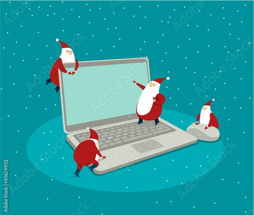 Funny little Santas over laptop