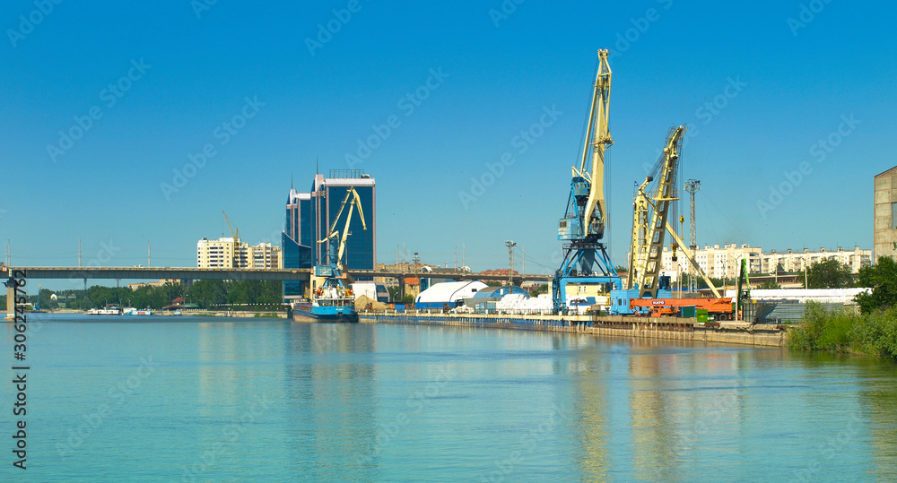 View of the bridge and cranes in the port in the city of Astrakhan. Russia.
