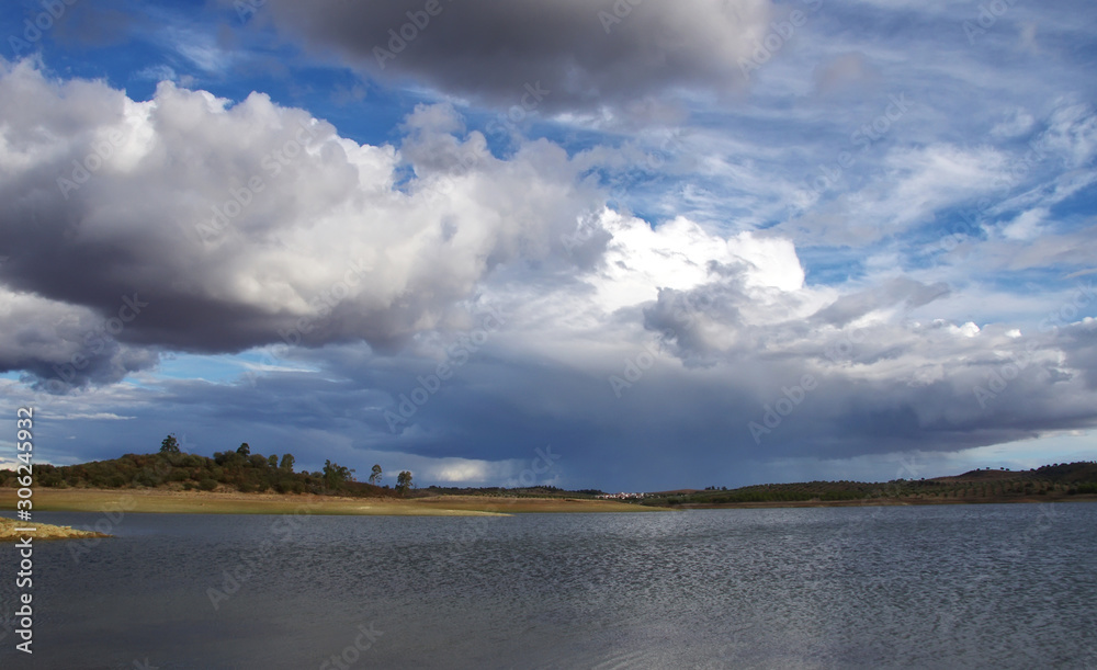 cloudy sky and alqueva lake near Amieira village, Portugal cloudy sky and alqueva lake near Amieira village, Portugal