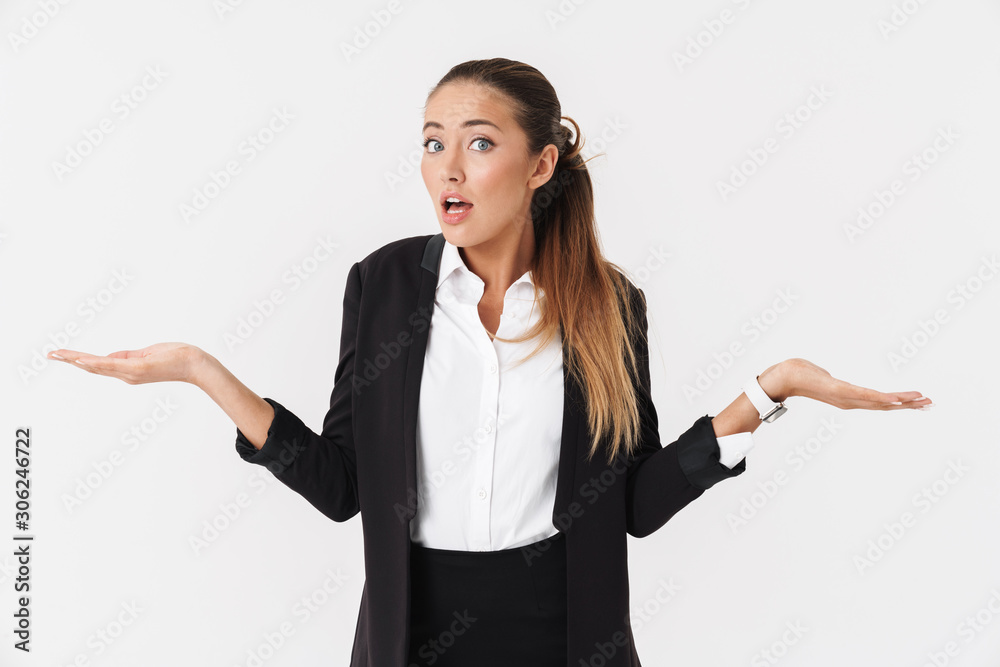Photo of shocked businesswoman looking at camera and holding copyspace Photo of shocked businesswoman looking at camera and holding copyspace