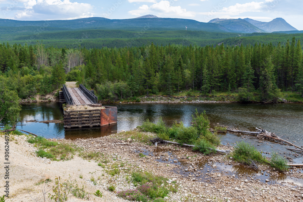 Part of a bridge remains over the Rancheria River in Yukon, Canada