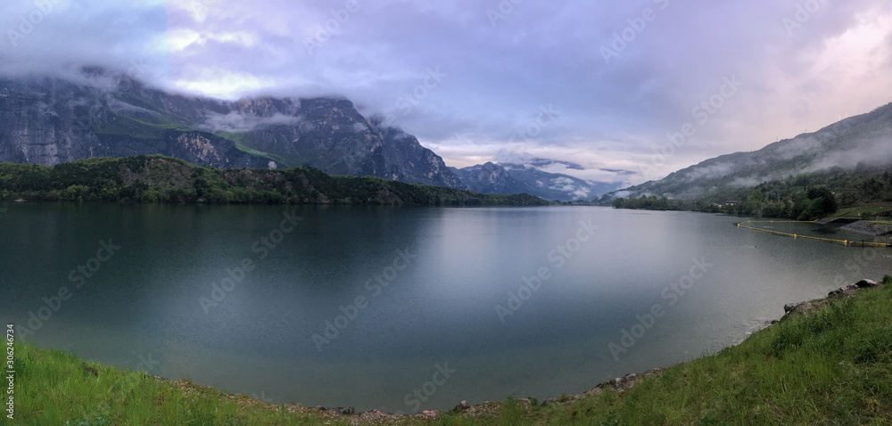 Lago Cavedine, Cavedine, Trentino, Italy. Lake with reflection, mountains and rocks.