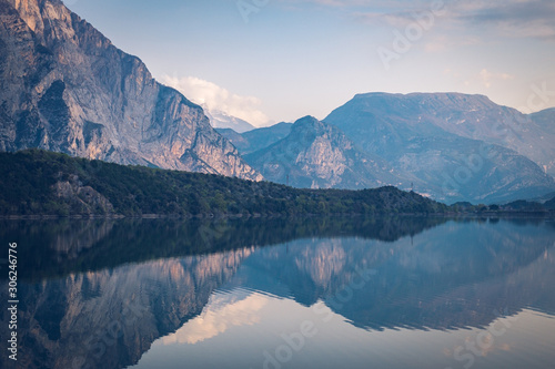 Lago Cavedine, Cavedine, Trentino, Italy. Lake with reflection, mountains and rocks. photo