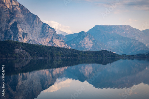 Lago Cavedine, Cavedine, Trentino, Italy. Lake with reflection, mountains and rocks.