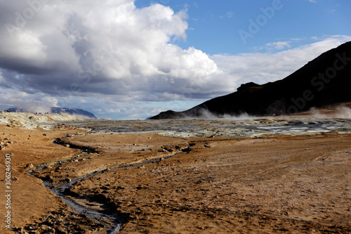 Volcanic area in Iceland. Boiling mudpots in the geothermal area Hverir and cracked ground around. Location  geothermal area Hverir  Myvatn region  North part of Iceland  Europe  