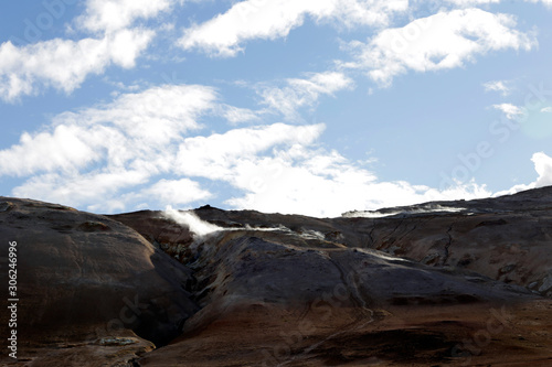 Volcanic area in Iceland. Boiling mudpots in the geothermal area Hverir and cracked ground around. Location: geothermal area Hverir, Myvatn region, North part of Iceland, Europe 