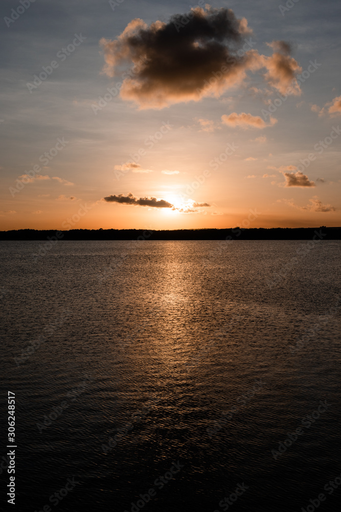 Obraz premium Romantic sunset over the river