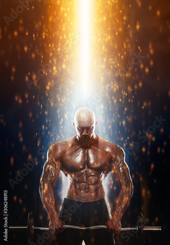Fit athlete man with barbell in fire. Energy and power. Strong muscular guy bodybuilder. Sport and fitness motivation. Individual sports recreation.