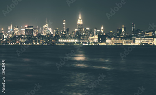 New York City panorama at night, color toning applied, USA.