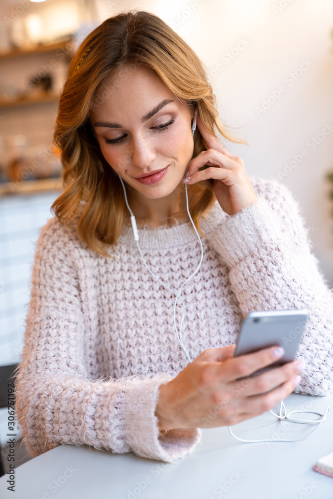 Beautiful pretty young blonde woman using mobile phone Beautiful pretty young blonde woman using mobile phone