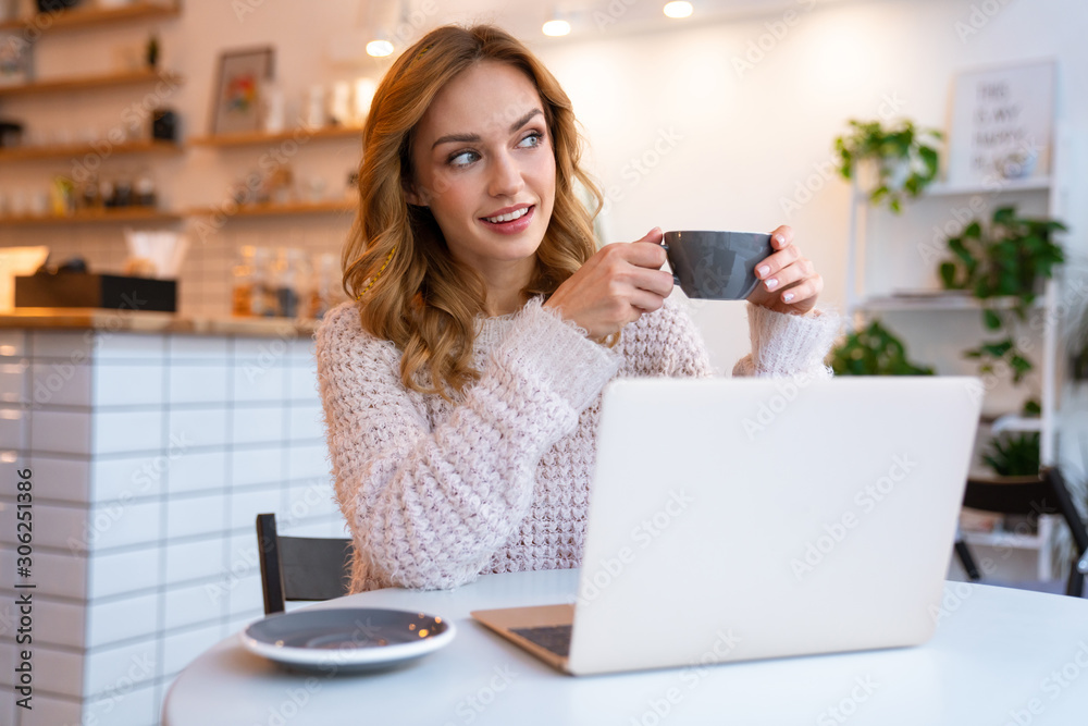 Happy optimistic young blonde woman sit in cafe Happy optimistic young blonde woman sit in cafe