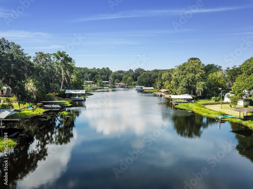 Aerial view of a river lined with boat docks