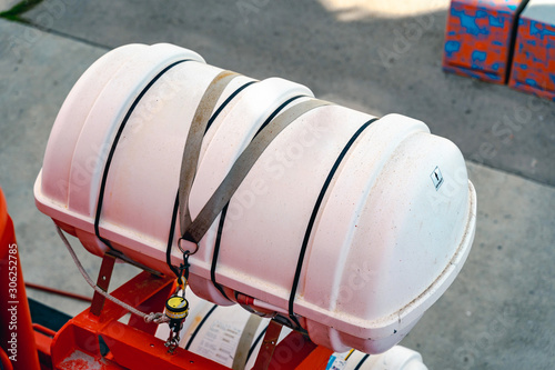 Inflatable liferaft in hard-shelled canister. Lifeboat, rescue vessel.