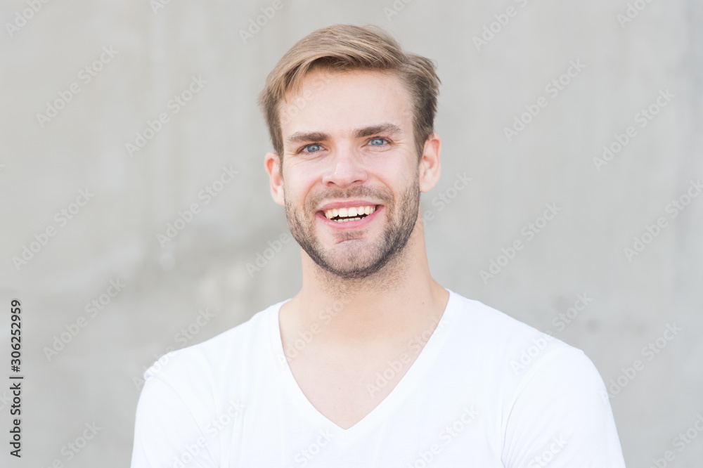 Your choice your pride. smiling macho man. summer male fashion. student unshaven face stylish hairstyle. Bearded man casual style. portrait of male attractiveness. young sexy guy gray background Your choice your pride. smiling macho man. summer male fashion. student unshaven face stylish hairstyle. Bearded man casual style. portrait of male attractiveness. young sexy guy gray background