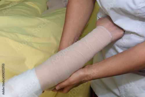 Lymphedema management: Wrapping Lymphedema Hand and Arm using multilayer bandages to control Lymphedema. Part of complete decongestive therapy (cdt) and manual lymphatic drainage (MLD)