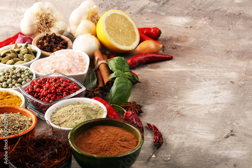 Fototapeta Naklejka Na Ścianę i Meble -  Spices and herbs on table. Food and cuisine ingredients for good cooking