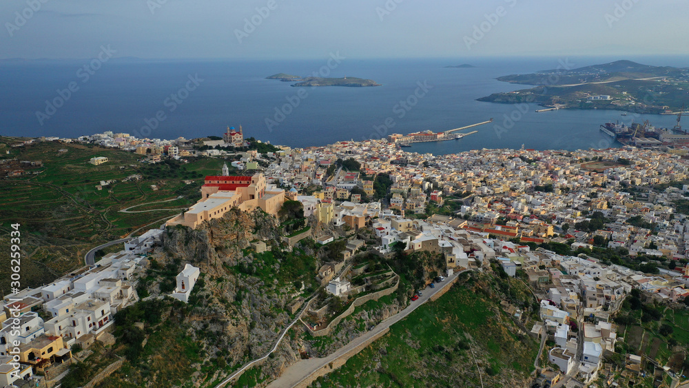 Aerial drone photo of iconic uphill catholic settlement of ano Syra featuring church of Saint George with beautiful colours, Syros or Siros island, Cyclades, Greece Aerial drone photo of iconic uphill catholic settlement of ano Syra featuring church of Saint George with beautiful colours, Syros or Siros island, Cyclades, Greece