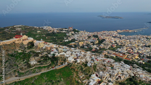 Aerial drone photo of iconic uphill catholic settlement of ano Syra featuring church of Saint George with beautiful colours, Syros or Siros island, Cyclades, Greece © aerial-drone