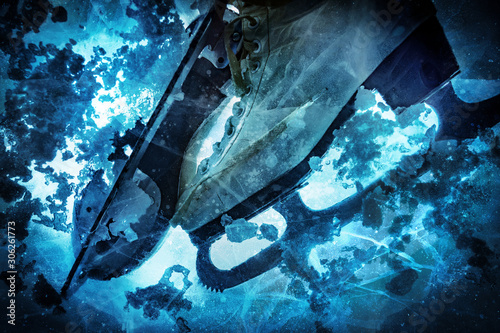 Ice skates taken from below the ice.