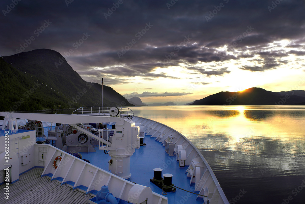 Cruise ship saling through fjords.