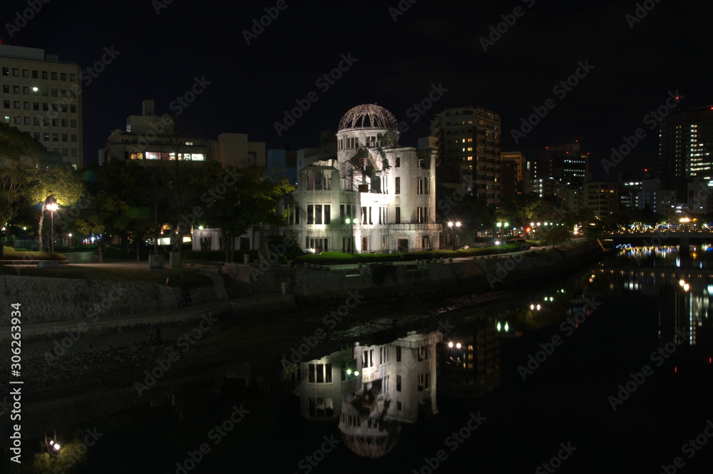 Bomb dome Hiroshima at night reflected in the water