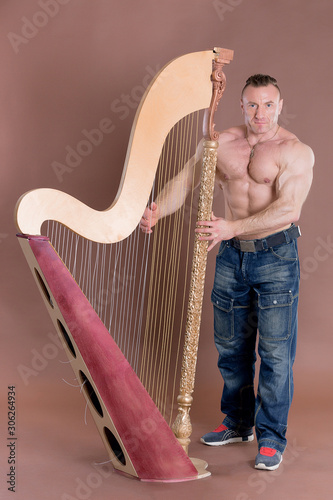 Photography athlete bodybuilder musician playing the harp