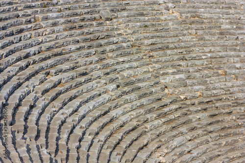 Mediterranean cityscape, background - view of the spectator seats in the theater of the ancient city of Myra, near the Turkish town of Demre, Antalya Province in Turkey