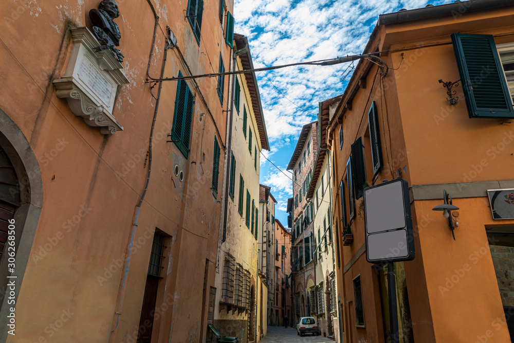 Narrow old cozy street in Lucca, Italy. Lucca is a city and comune in Tuscany. It is the capital of the Province of Lucca