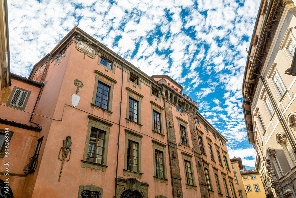 Fototapeta premium Old cozy street in Lucca, Italy. Lucca is a city and comune in Tuscany. It is the capital of the Province of Lucca