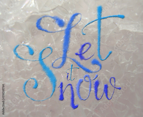 "Let it Snow" Sign on Crackled Ice Background. Winter Holiday design for Christmas and New Year Celebration.
