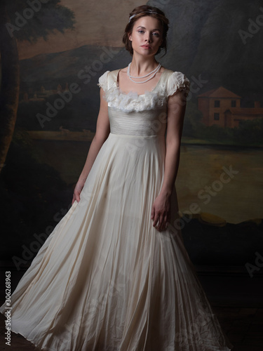 Принти на полотні Beautiful young woman in a white long dress in the style of the 19th century