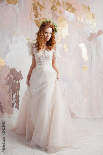 Elegant red-haired girl bride. Young beautiful woman in wedding dress