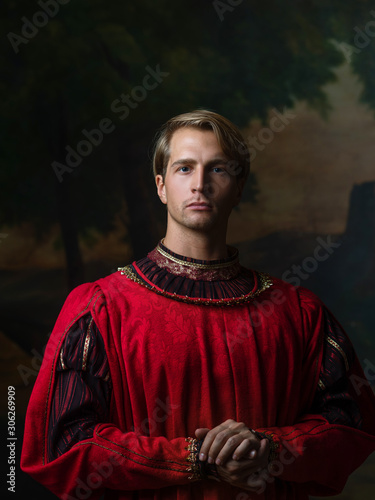 handsome man in a Royal red doublet