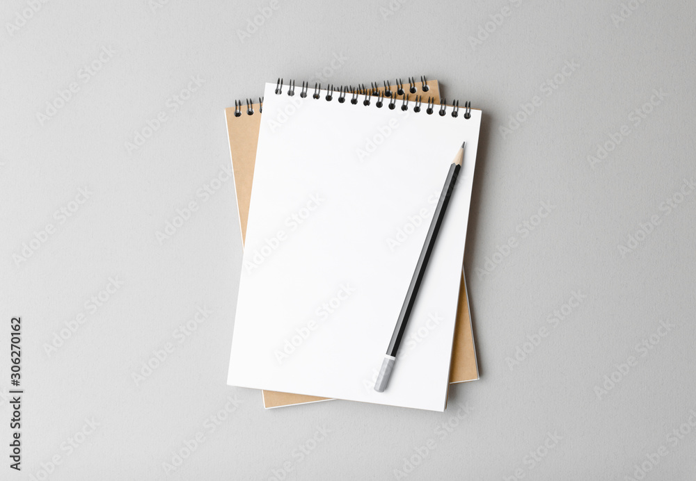 notebook with pencil on a gray background notebook with pencil on a gray background