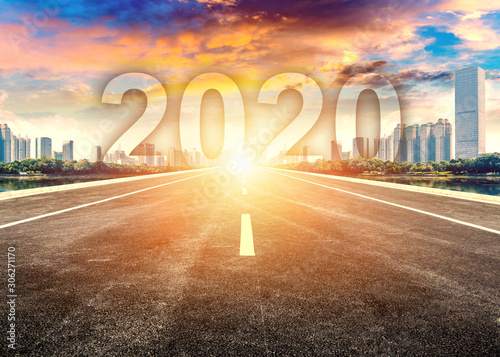 Straight ahead to the modern city with the New Year 2020 concept. The 2020 number written in modern cities.
