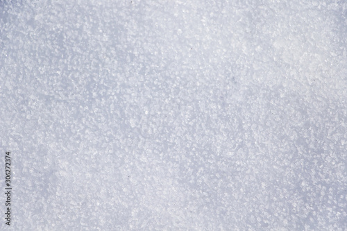 Texture of white gentle snow closeup