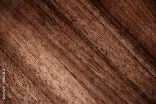The texture of a wooden board closeup. Defocused background.
